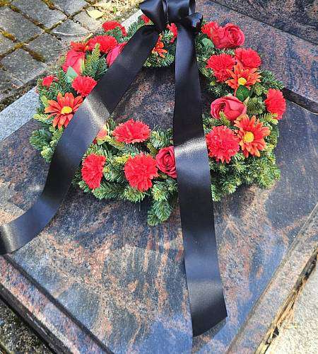 Artificial red wreath Roses and carnations
